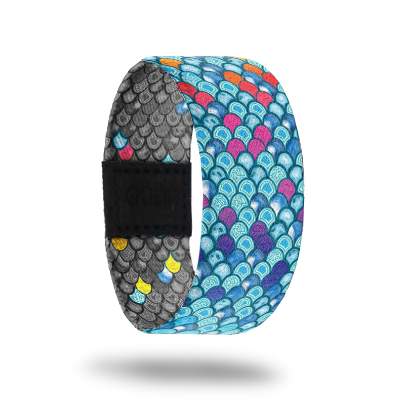 Be Kind-Sold Out-ZOX - This item is sold out and will not be restocked. Bright blue scales of a mermaid with random pink and orange ones. Inside is all gray scales with random colored ones and says Be Kind. 