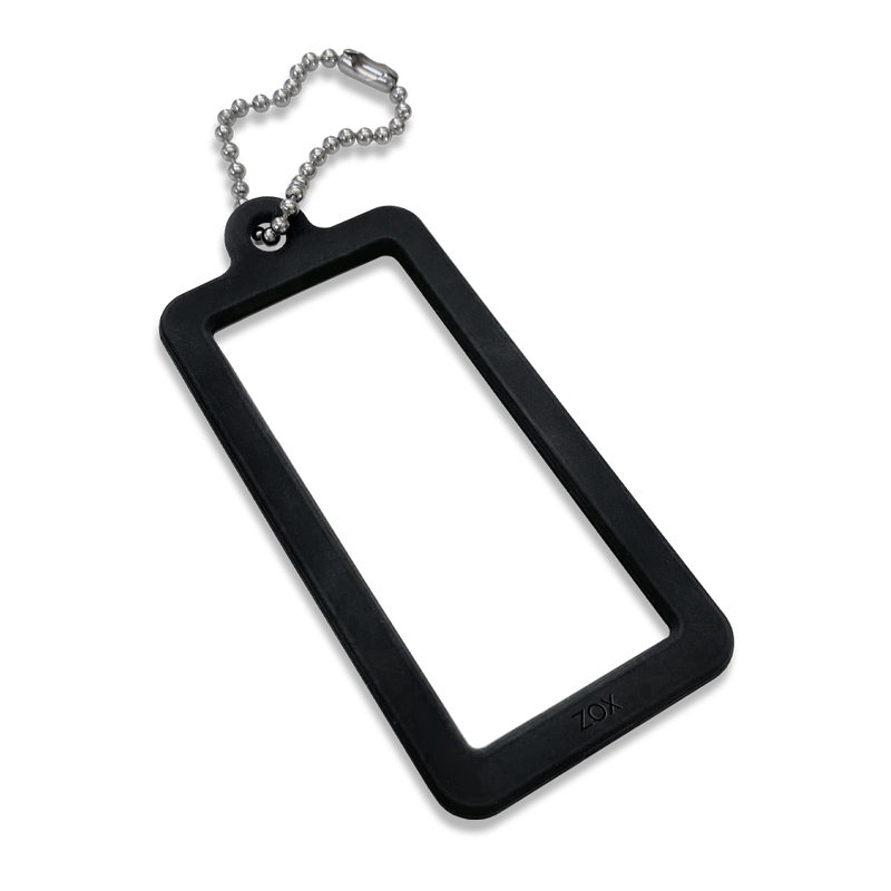 This is a cardlox. It is a silicone black rectangle with a clear poly sleeve to store the motivational card that comes with your ZOX. It has a metal key ring on the end to use for backpacks, keys, luggage, etc. The pack comes with 2. 