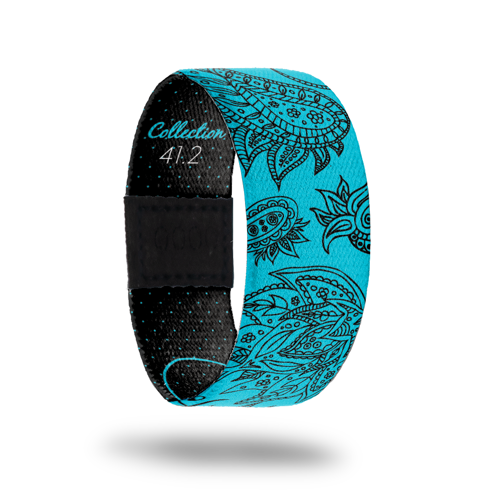 Carefree 2-Sold Out-ZOX - This item is sold out and will not be restocked. Bright blue base with black mosaic design of flowers all over. Inside is black with tiny blue dots and says Care Free. 
