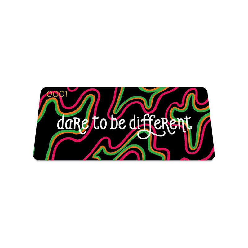 Front collector's card image of  Dare to Be Different: black background with pink, orange and green in irregular shapes throughout the card and text 'Dare to Be Different'
