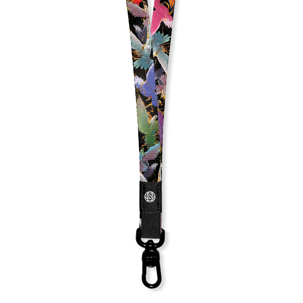 Black lanyard with multicolored birds flying in gold twigs. 