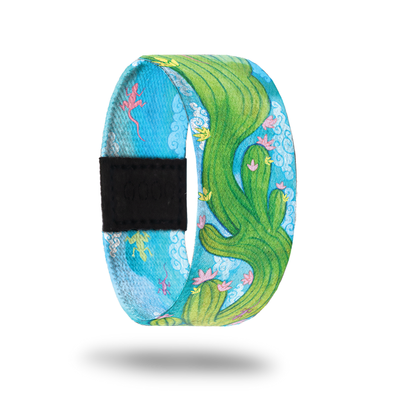 Outside Design of Endurance: light blue sky background with green cactus with pick and yellow flowers waving through the center of the strap
