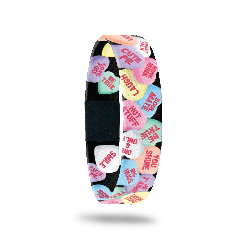 ZOX single with black base and littel Valentines conversation hearts (like the candy). Inside is the same and reads Feel The Love. 