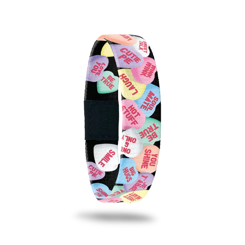 ZOX single with black base and littel Valentines conversation hearts (like the candy). Inside is the same and reads Feel The Love. 