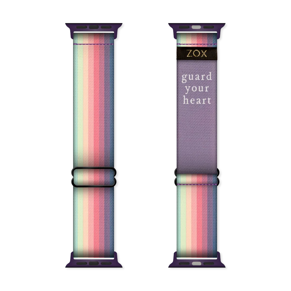 Watchband with a muted rainbow from one end to the other. Inside reads Guard Your Heart. Check size guide for compatible watches. 