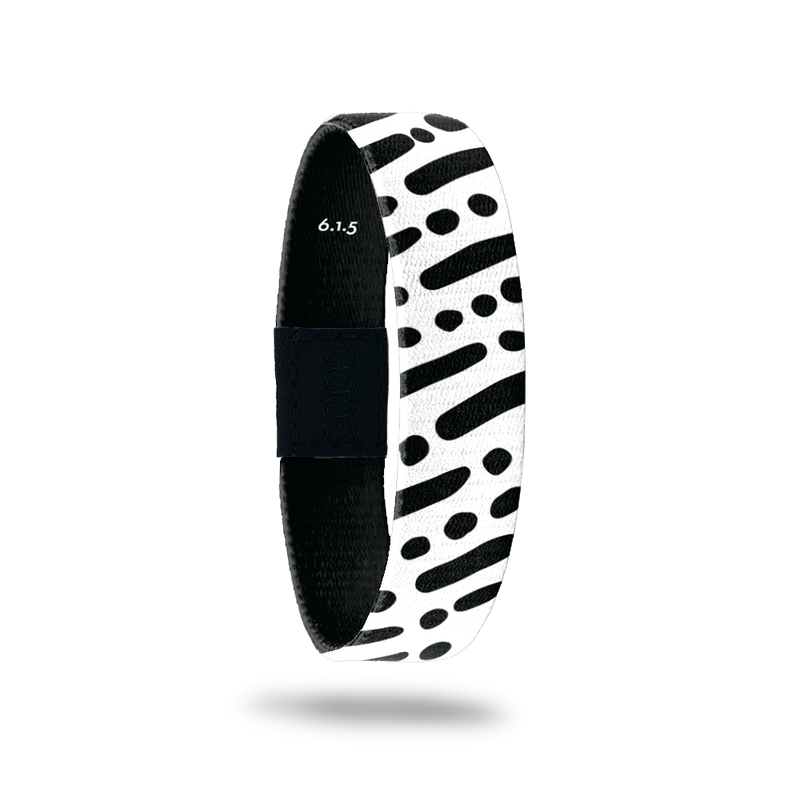 Wristband single is black and white lines and dots in a diagonal pattern. The inside is the same and reads I Am With You Always with the Bible verse 6.1.5.