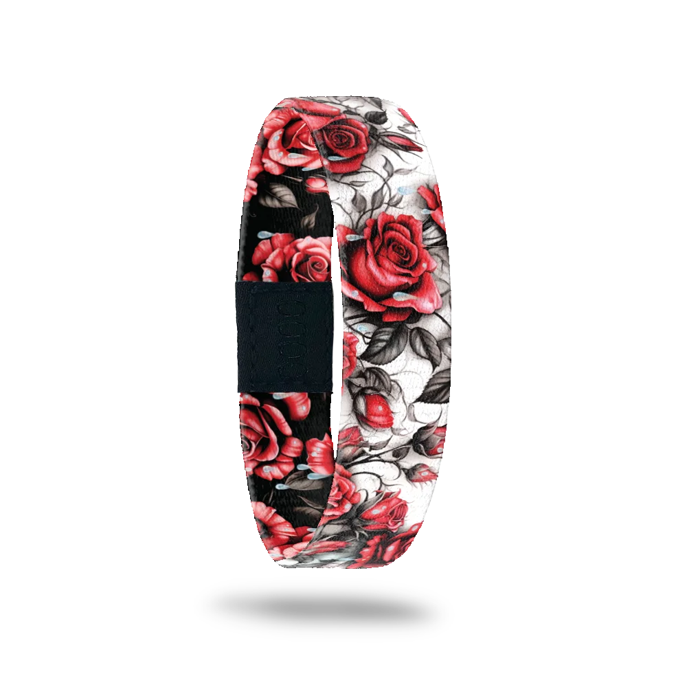 Wristband single is a white base with a realstic design of red roses with black/grey leaves and vines. The inside is the same except has a black base and reads I Feel The Same. 