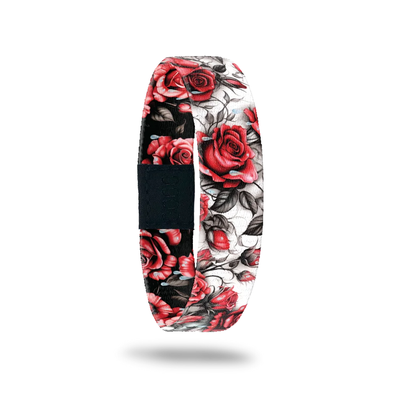 Wristband single is a white base with a realstic design of red roses with black/grey leaves and vines. The inside is the same except has a black base and reads I Feel The Same. 