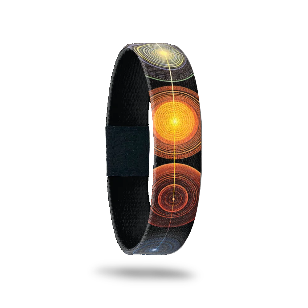 Outside is black with circle patterns in yellow, orange, red and slate grey.