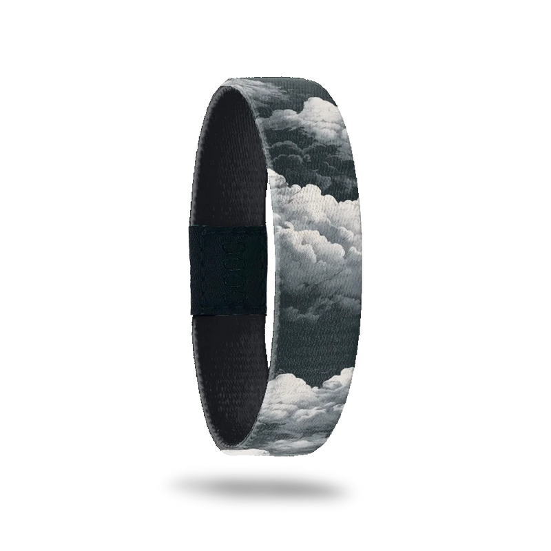 Wristband single is a design of grey and white clouds all over. The inside is all grey and reads In Loving Memory.
