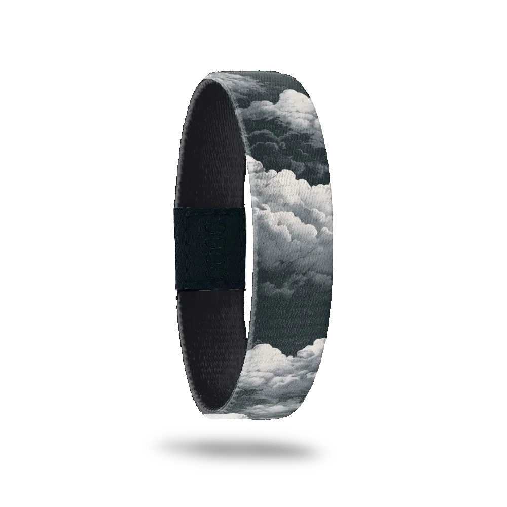 Wristband single is a design of grey and white clouds all over. The inside is all grey and reads In Loving Memory.