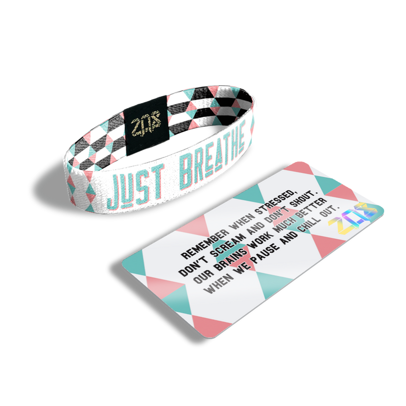 Inside Design of Just Breathe: geometric white and pink design with blue with pink outline text ‘Just Breathe‘ and its card which says 'Remember when stressed, don't scream and don't shout. Our brains work much better when we pause and chill out.'