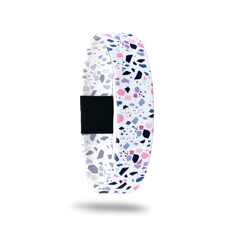 ristband single with a white base. The design is purple, pink, black and grey speckles all over. The inside is the same and reads Know Your Worth. 
