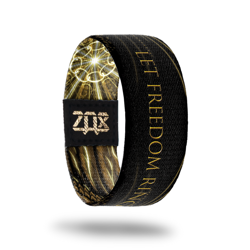 Inside design of Let Freedom Ring. Black background with Let Freedom Ring in gold color text