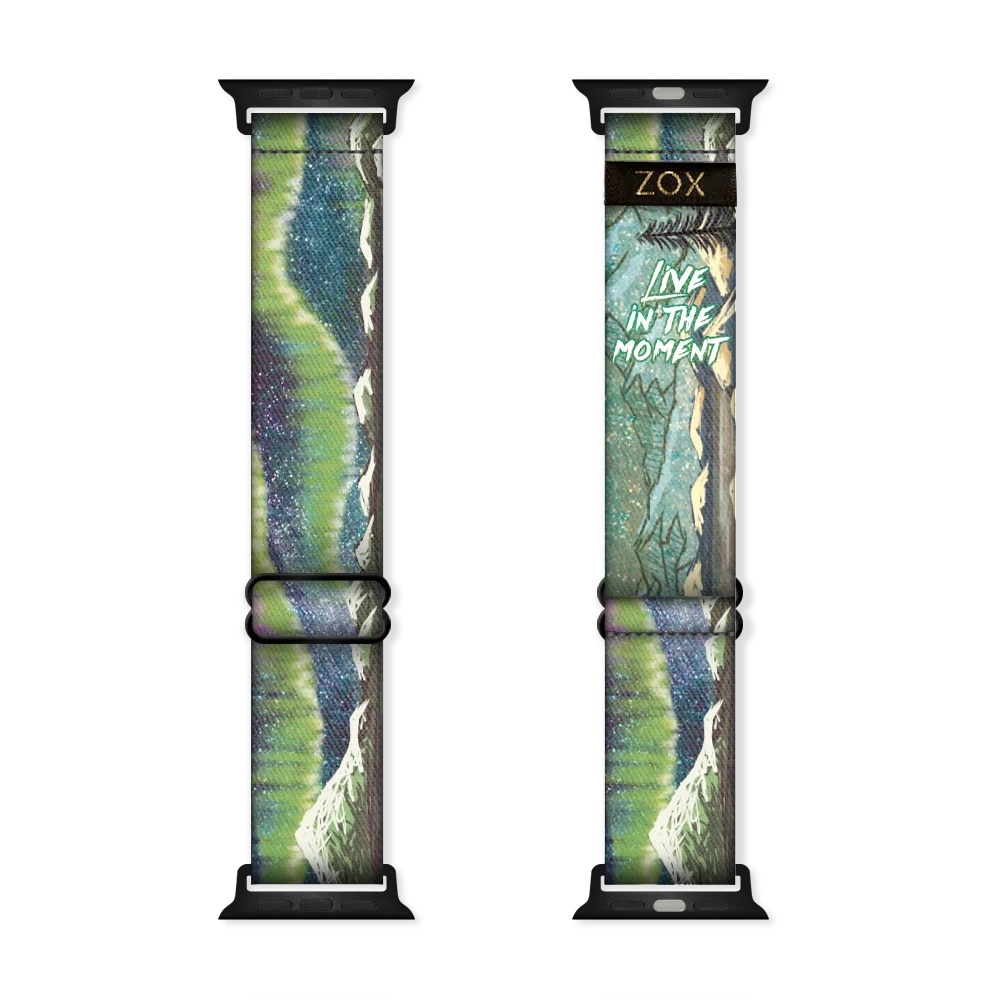 Watchband with a green and blue design of the NOrther Lights. Inside is the same and reads Live In The Moment. Check the size guide for applicable watches. 