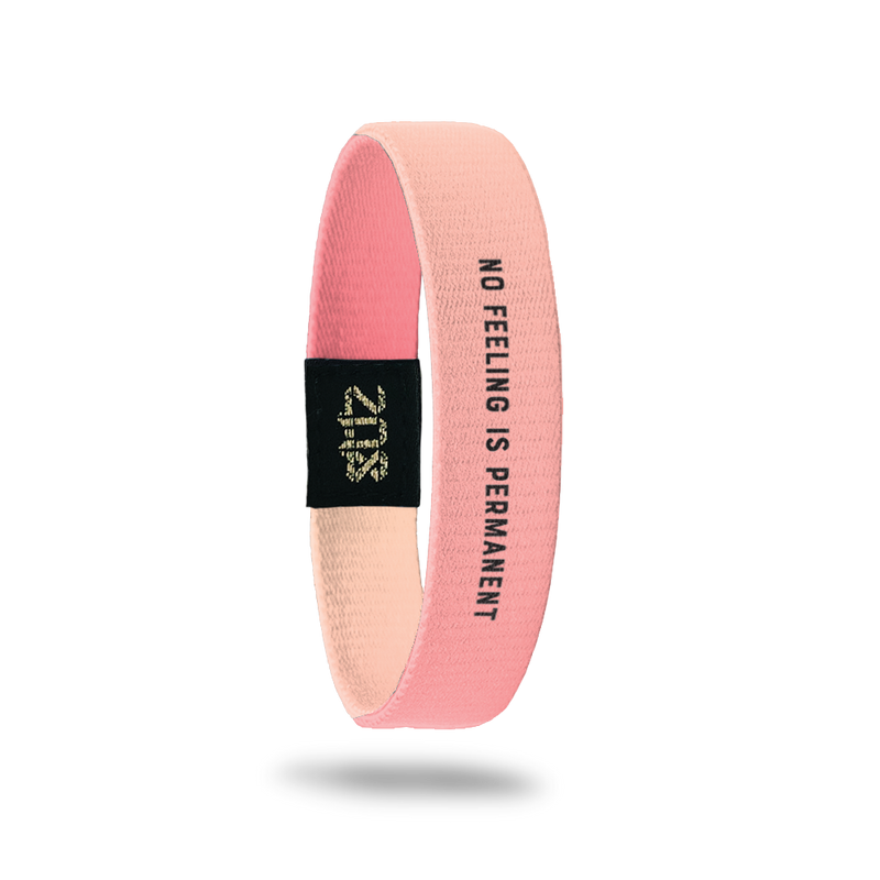 Product photo of inside design with small bold black text no feeling is permanent overlaying a pink to peach gradient