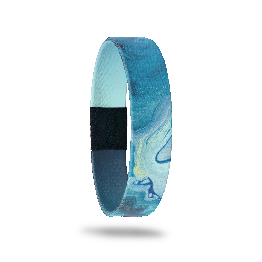 Wristband single that is variations of blue color and looks like watercolor swirls. The inside is blue/nacy gradient and reads Persevere. 