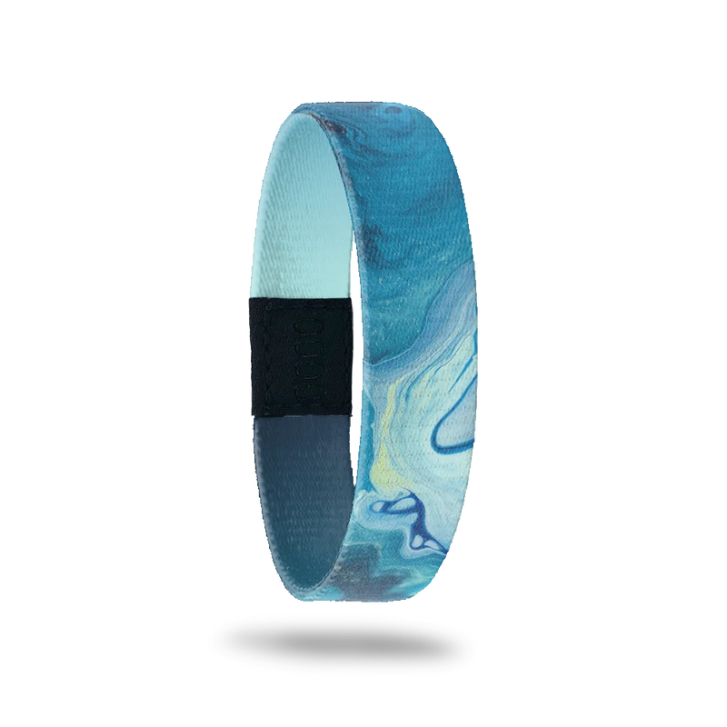 Wristband single that is variations of blue color and looks like watercolor swirls. The inside is blue/nacy gradient and reads Persevere. 
