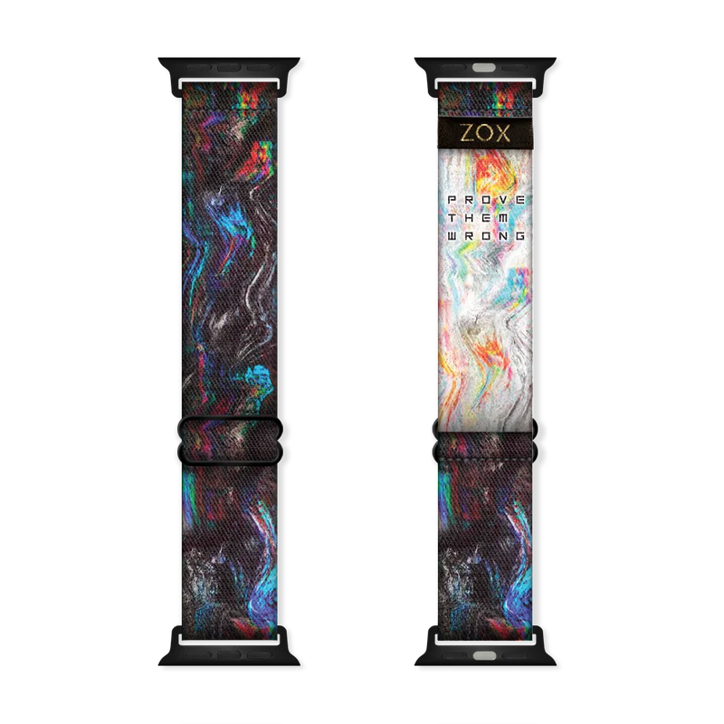 Watchband with all black and specs of multicolored swirls The inside is the same and reads Prove Them Wrong. . 