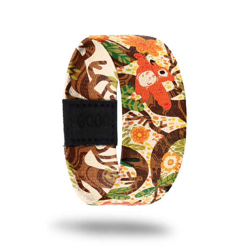 Wristband strap is a cartoon scene of a bear climbing a tree. The inside is the same and reads See What's In Store. Comes with a matching lapel pin and collector's box. 