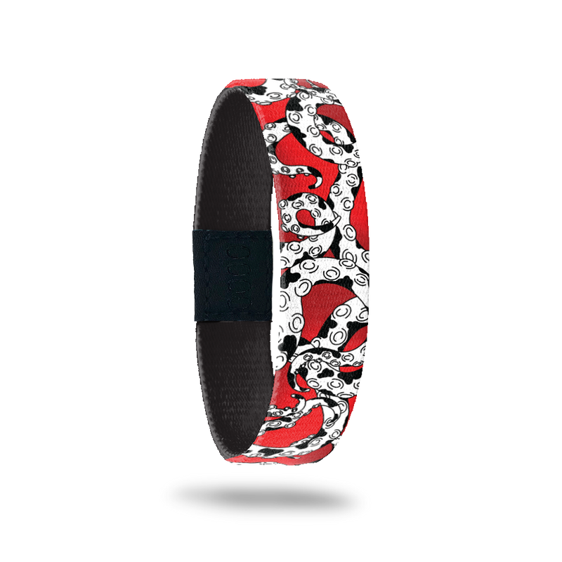 Red design with white and black octopus tentacles all over. Comes with a matching pin of an octopus monster in a vampire coat that looks like a dalmation with spots. 
