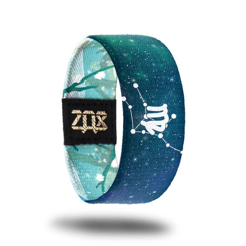 Inside design shows the Virgo symbol in the center of the strap while also having the astrological star formation behind it. Background is a blueish green tone with white dots symbolizing stars all over it.