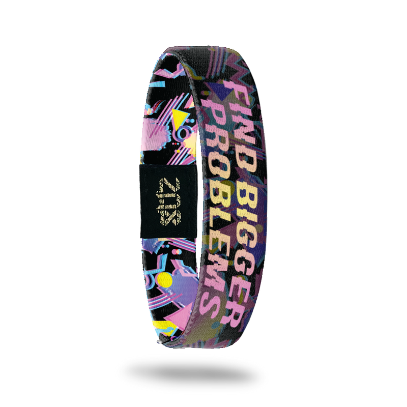 Product photo of inside design with bold text find bigger problems in a pink to yellow gradient with transparent neon geometric designs overlaying a black background