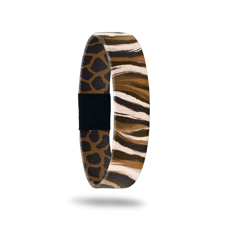 This is a reversible single. The design is brown, white and black zebra print. The inside is brown abd black giraffe print with the words Broken But Not Defeated. 