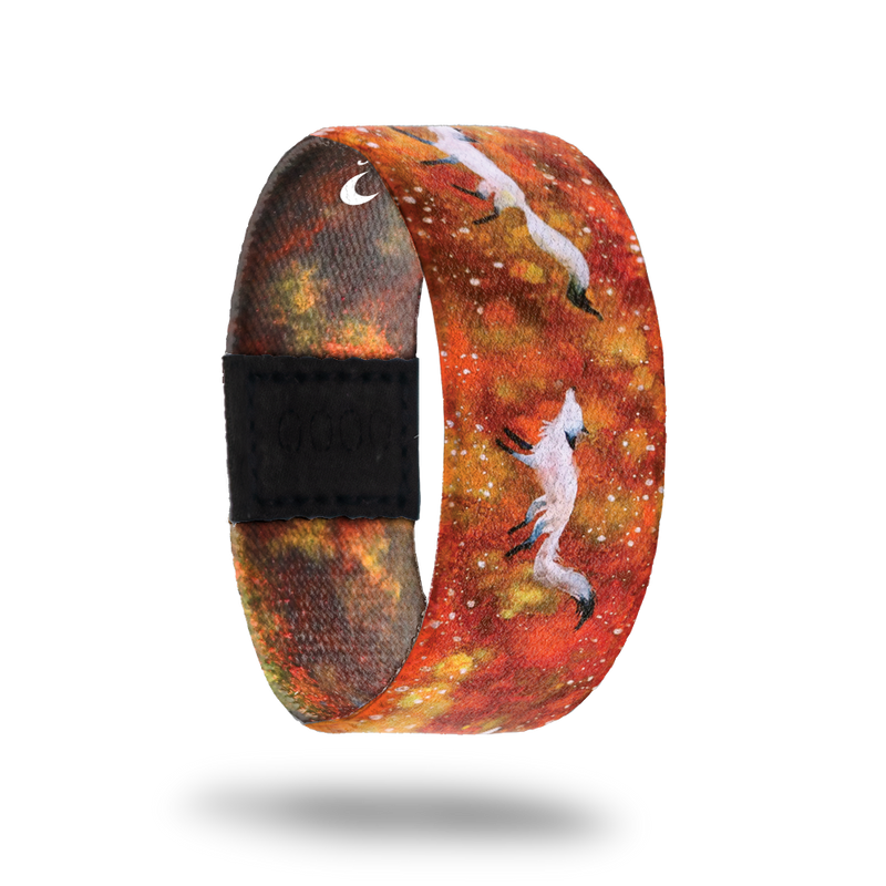 This is a reward item and not purchasable. The design is orange and red nebula with white foxes running along the strap. The inside is the same and reads Courageous. This is the moonstone for the Series 1 collection. 
