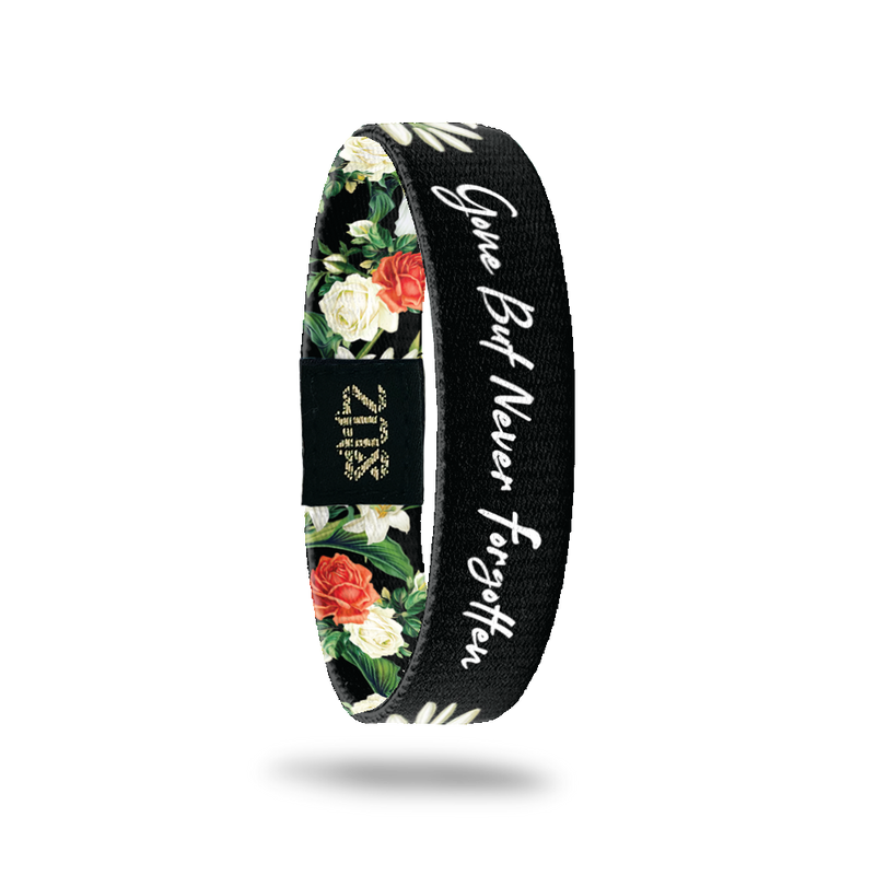 Inside Design of Gone But Never Forgotten: black background with red and white floral and greenery design with opening that has the white text ‘Gone But Never Forgotten’