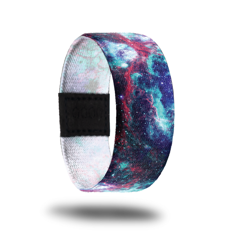 Outside design of I Am____. A space image with blends of dark purple, light blue, and red-pink.