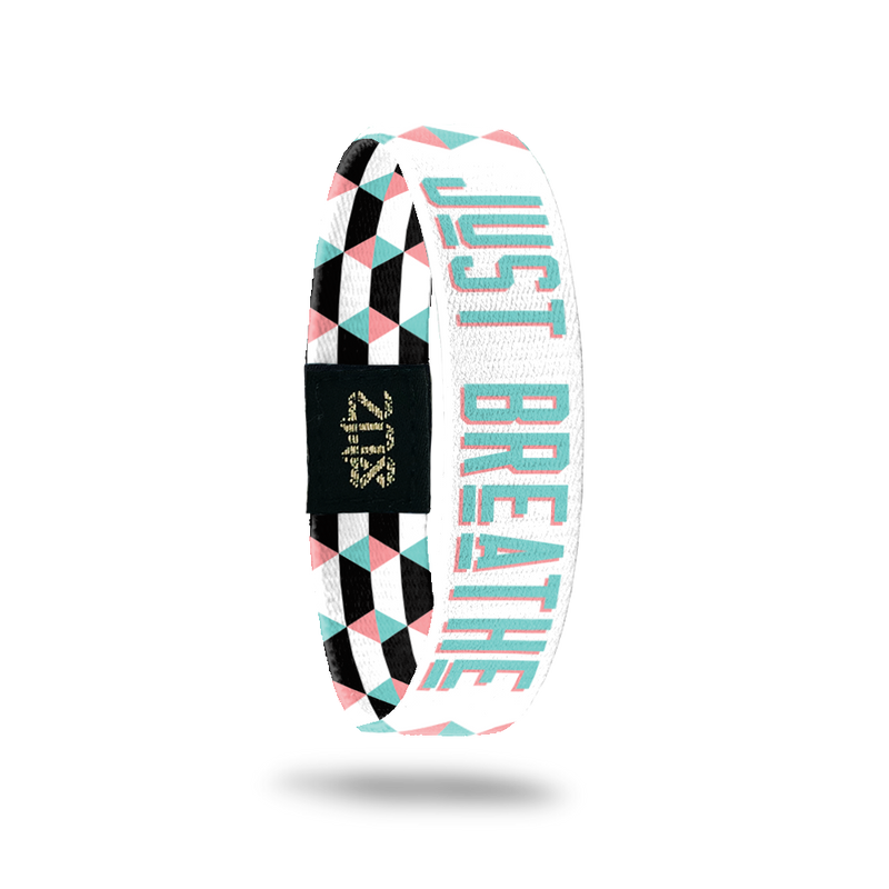 Inside Design of Just Breathe: geometric white and pink design with blue with pink outline text ‘Just Breathe‘