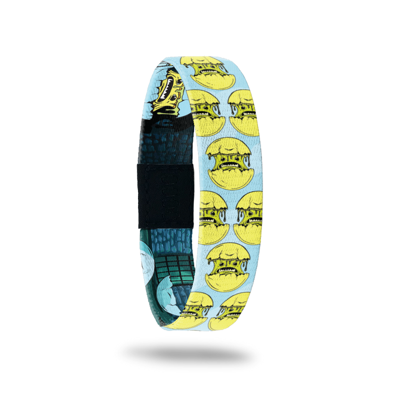 Product photo of the outside of 2020 - Day 1 - Mr. Oh My Gosh: light blue design with repeating green monsters coming out of a yellow shell