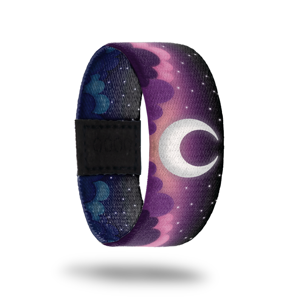 Outside Design of Selenophile: purple clouded night skies with white stars and a white crescent moon in the center