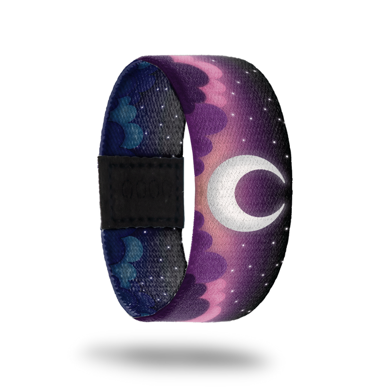 Outside Design of Selenophile: purple clouded night skies with white stars and a white crescent moon in the center
