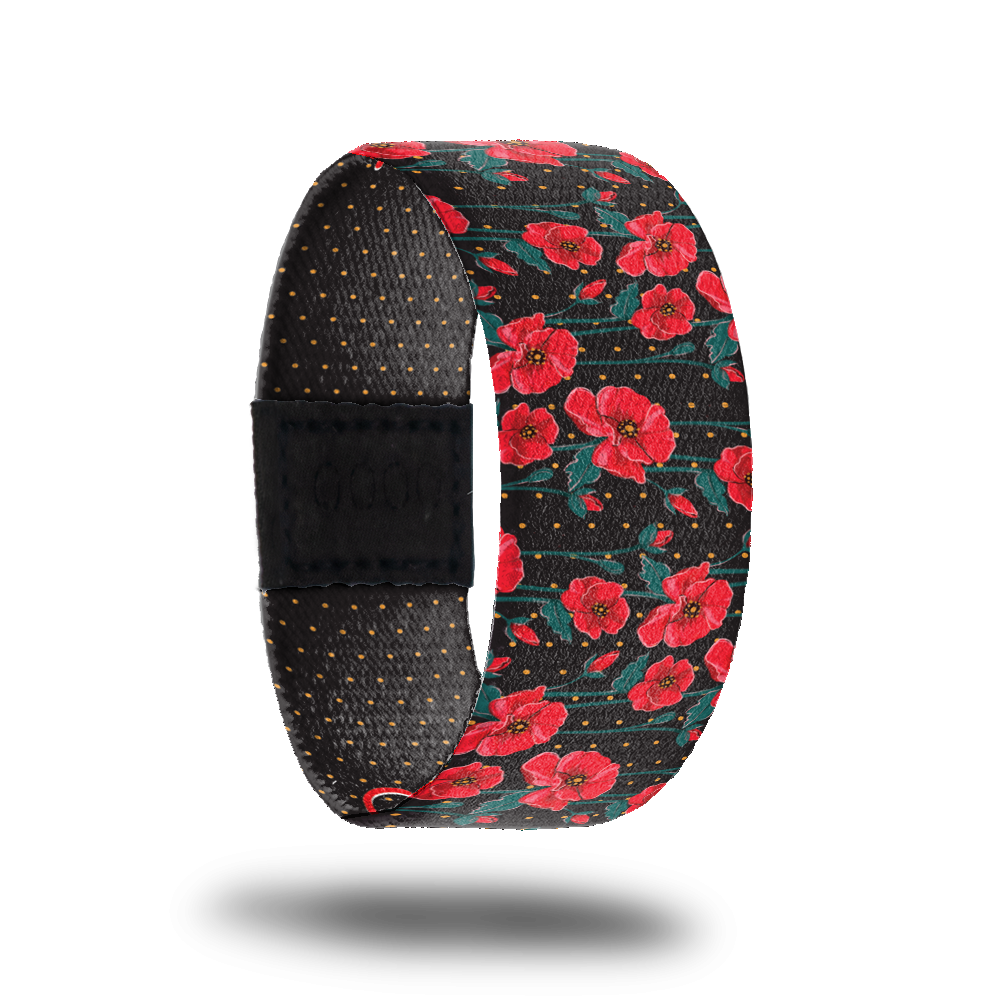 Outside design for Self Love. Black background with small red dot patteren and on top red flowers with small green leaves