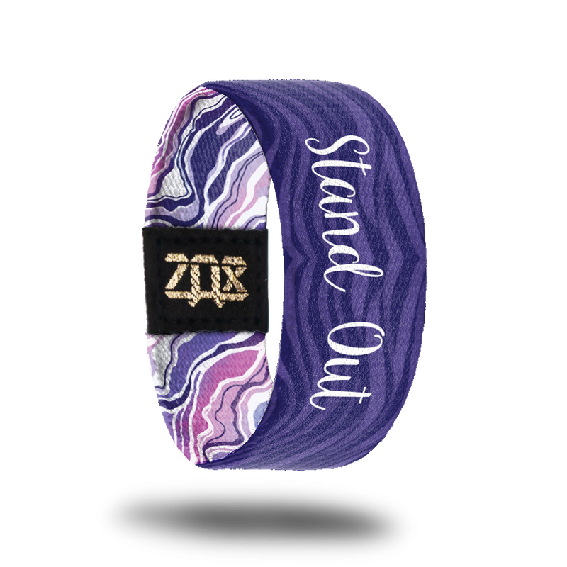 Inside design for Stand Out. Wavy striped background of dark and light purple and centered is Stand Out in white text