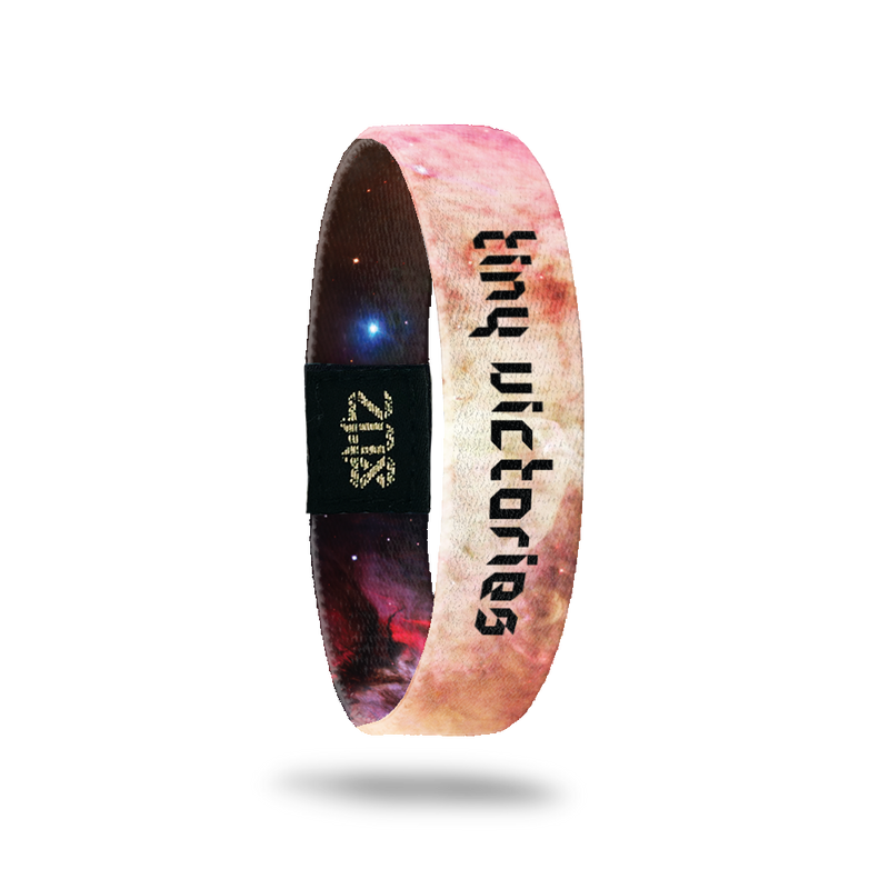 Inside Design of Tiny Victories: light pink, tan, light purple, and white galaxy with black digital text overlaying 'tiny victories'