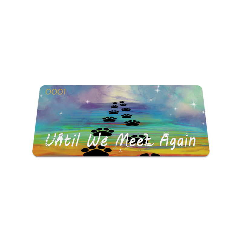 Front collector's card image of Until We Meet Again: rainbow skies with white stars and a darker rainbow bridge with black paw prints going up it with white text 'Until We Meet Again'