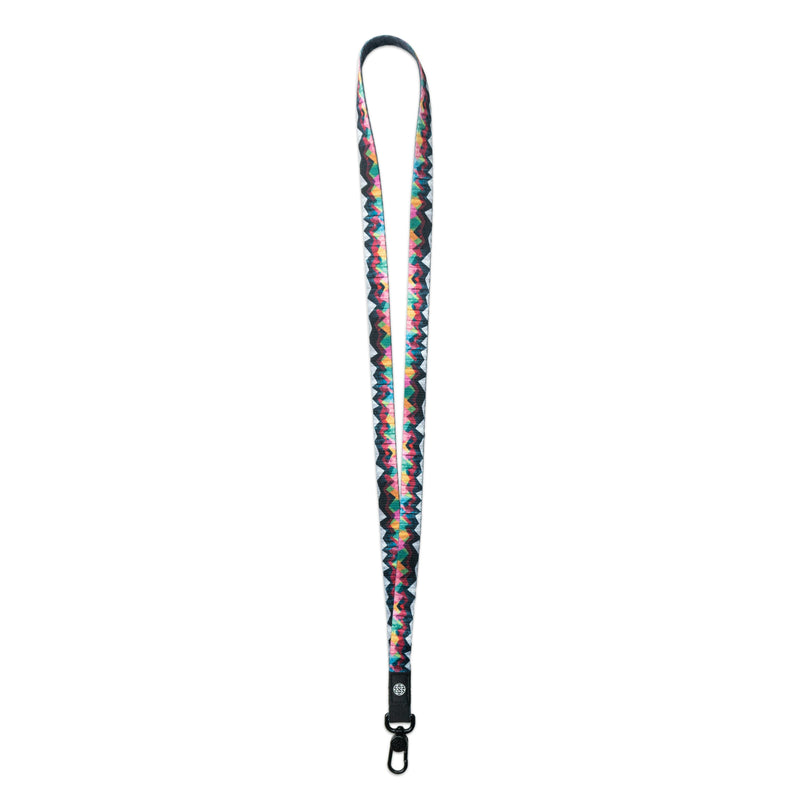 A product image of a ZOX lanyard showing the front of the design with a black colored metal clip. The lanyard is called Mountains To Molehills and the design is an geometric mountain range with mainly different colors such as blue, grey, blue, green, orange, yellow, and pink 