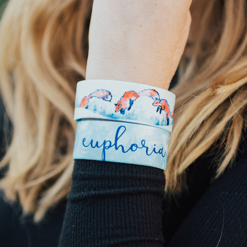 Lifestyle close up image of model's wrist wearing 2 Euphoria straps