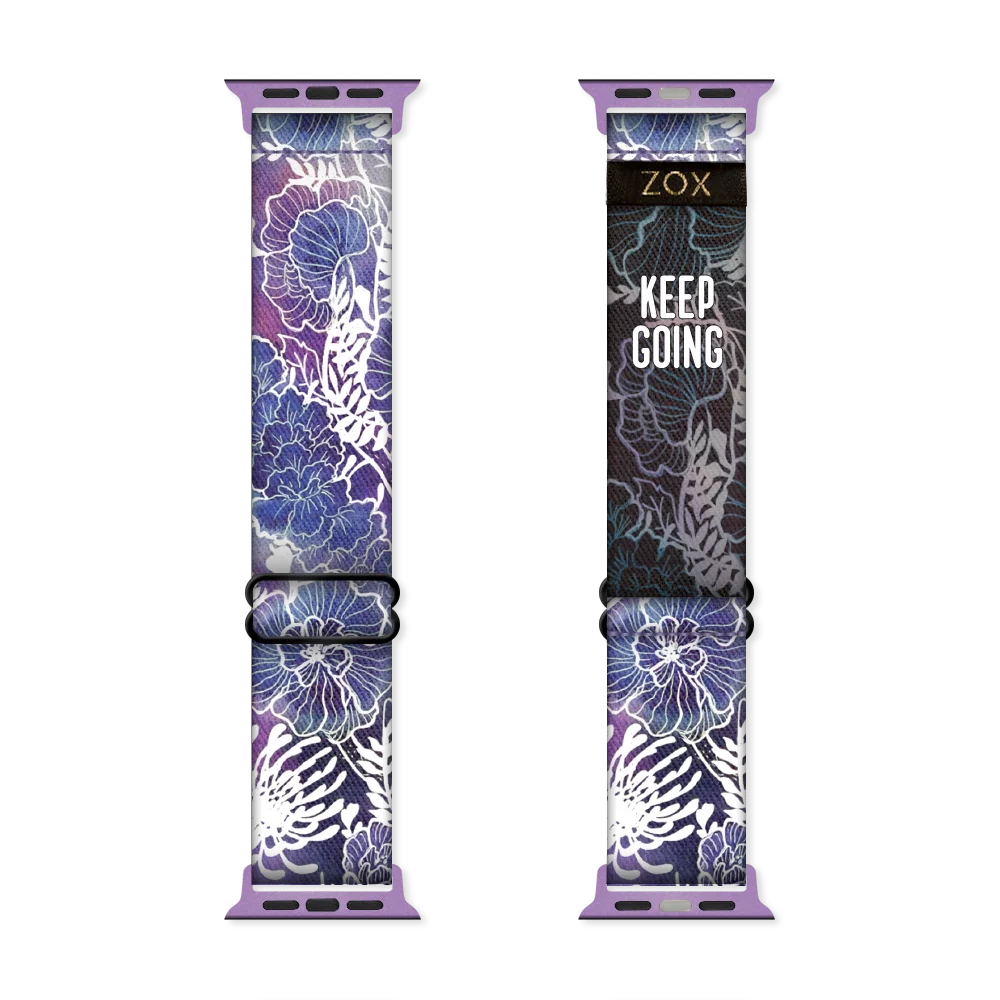 Watchband with various purple flowers, trimmed in white lines. The inside is the same and says Keep Going. Check size guide for compatible watches. 