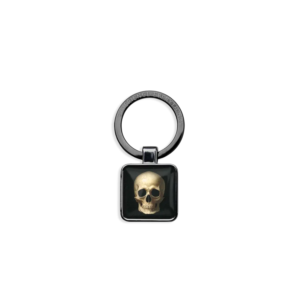 ZOXlox keychain for a wristband single only. The rectangle dangle is black with a weathered skull on one side and Memento Mori on the other side.