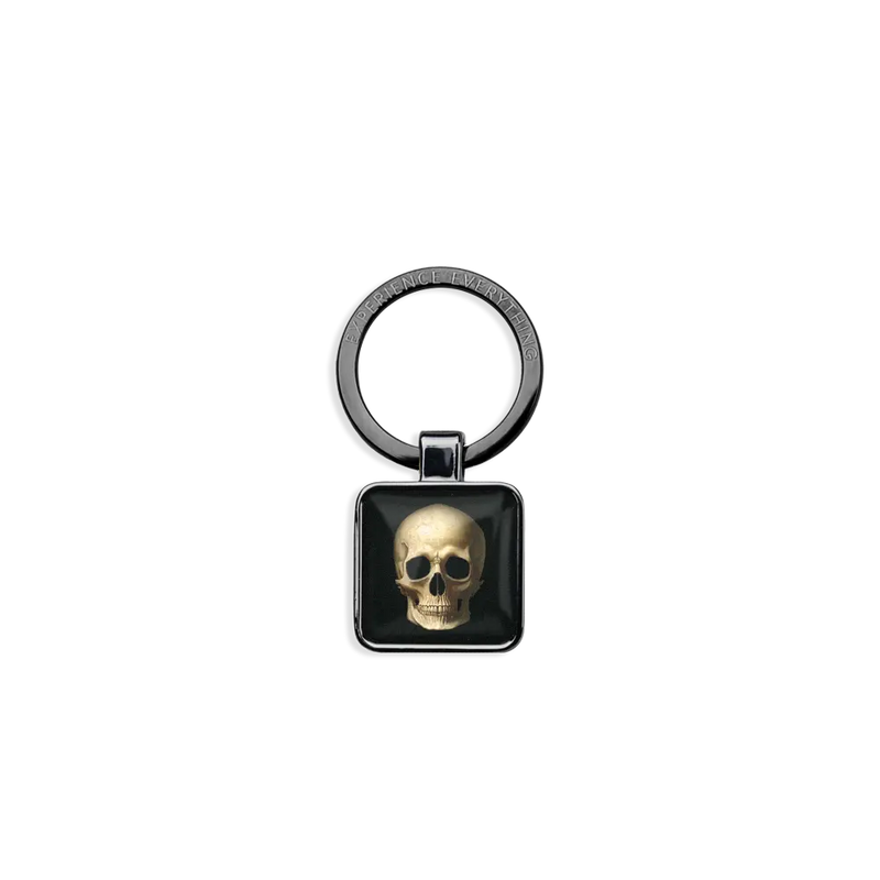 ZOXlox keychain for a wristband single only. The rectangle dangle is black with a weathered skull on one side and Memento Mori on the other side.