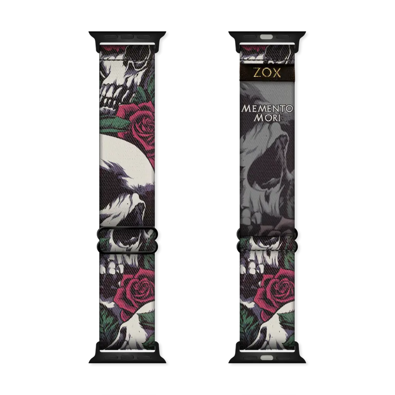 Watchband has a black base and is grunge looking. It has a design of white and grey skulls up close with roses and leaves. The inside is the same and reads Memento Mori. Check out size guide for compatible watches. 