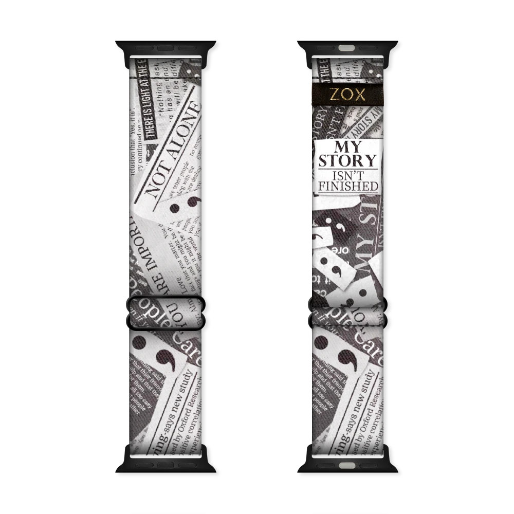 Watchband with a black and white newspaper clipping design. The text is upclose and has random "headlines" of motivational words such as "not alone".  The inside is the same and reads My Story Isn't Finished. Check out the size guide for compatible watches.