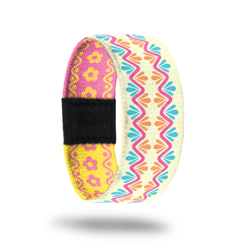 Wristband strap has 4 variations of similar design but each is different and selected at random. All colorways have pastel colors of pink, yellow, blue and orange and have swirls, lines, flowers, dots etc. 