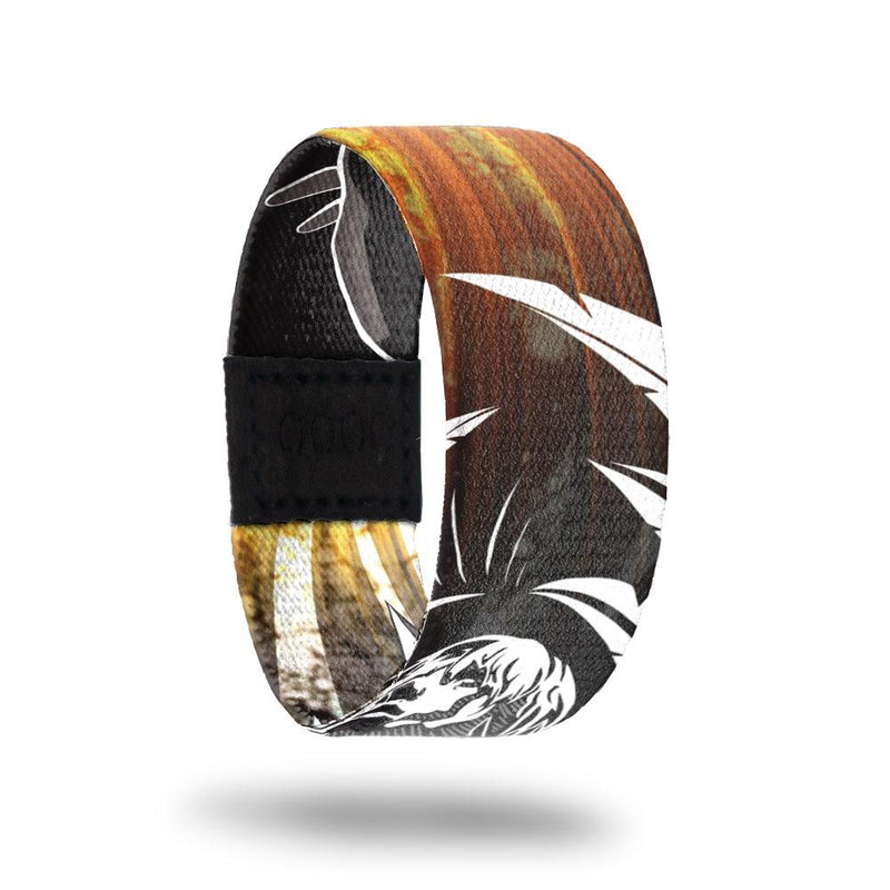 Ascend-Sold Out-ZOX - This item is sold out and will not be restocked. Brown and gold rays across the outside with a white line drawing of a guardian angel or soldier with wings. Inside is the same and says Ascend. 