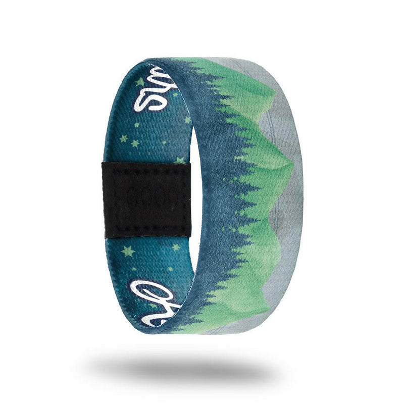 Ascend To The Stars-Sold Out-ZOX - This item is sold out and will not be restocked. Outside is a forest scene with green mountains and grey skies. Inside is a blue sky with green stars and says Ascend To The Stars. 