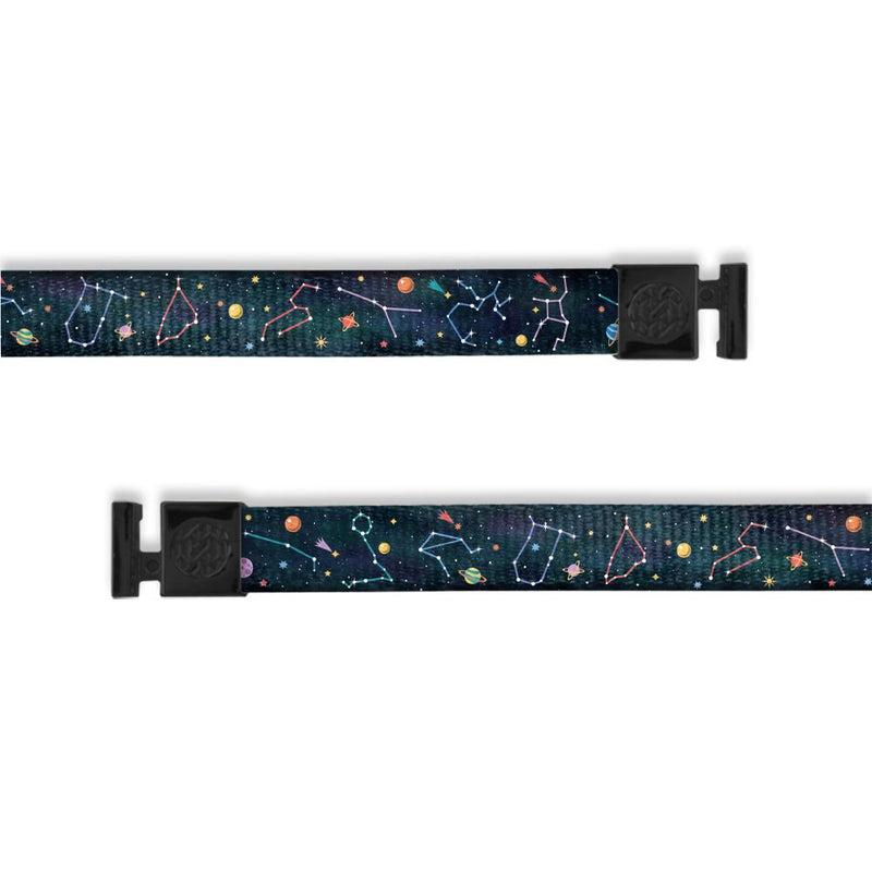 A product image of a wide and flat string with black metal aglets meant to be used with the ZOX hoodie. The string is called Constellations and is a design of the solar system showing the constellations. It is a dark blue watercolor background with little imagery of planets on the front as well as stars with outlines of the constellations.